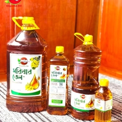 Pure mustard oil from the first pressing in a wooden mill. কাঠের ঘানিতে ভাঙা প্রথম চাপের খাঁটি সরিষার তেল